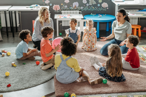 young children and teachers in class playing