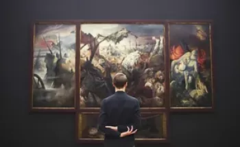 A man in front of a painting 