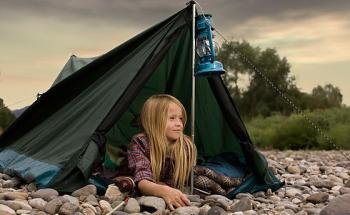 a girl in a camping tent