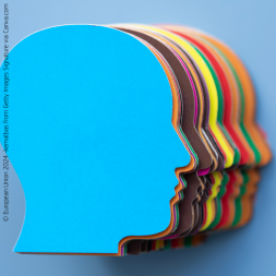 Overlapping silhouettes of faces of different colours