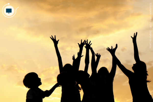 Kids silhouette in a field, playing